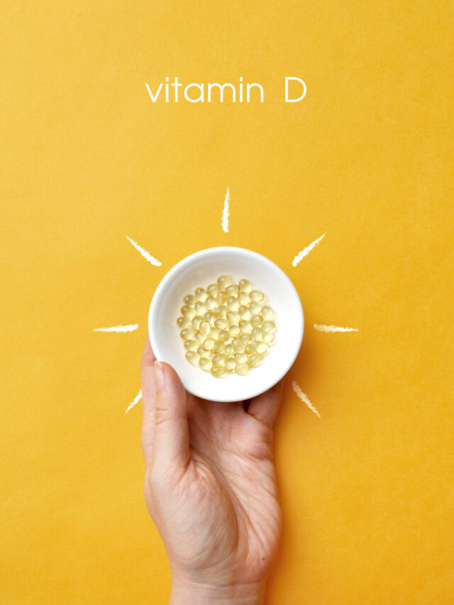 Tablets on a plate inside a picture of the sun and the inscription: vitamin D